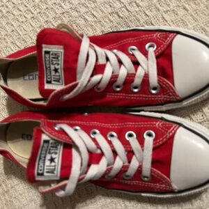Red “Chuck Taylors” All Star Converse sneakers